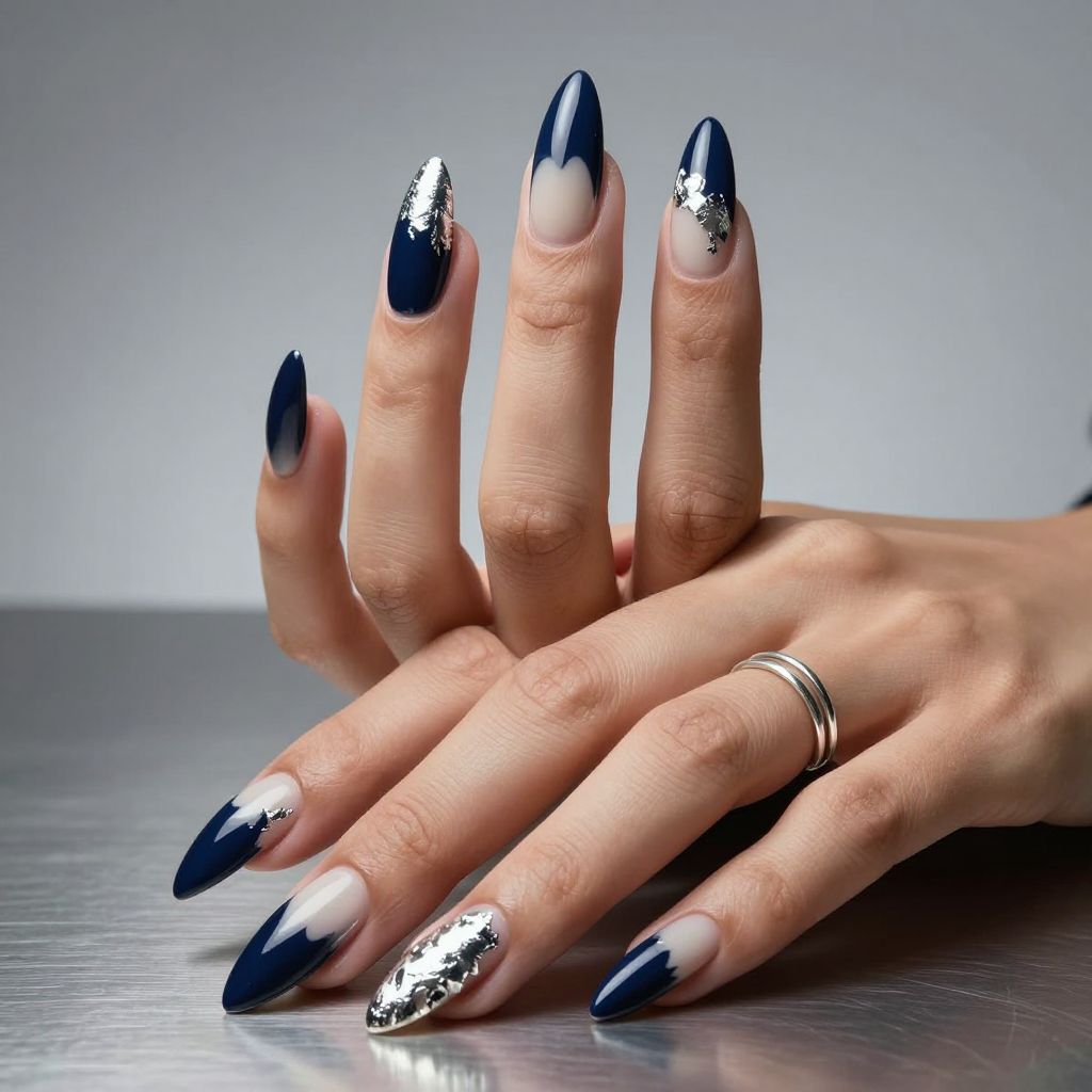 Navy stiletto nails with silver foil tips