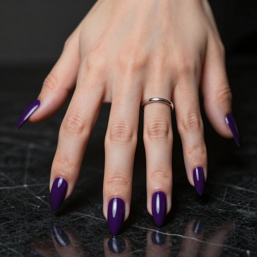 Eggplant glossy purple stiletto nails